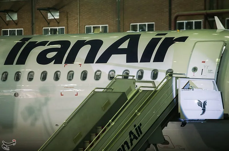 An Iran Air aircraft parked at a gate with boarding stairs at Tehran's Mehrabad International Airport