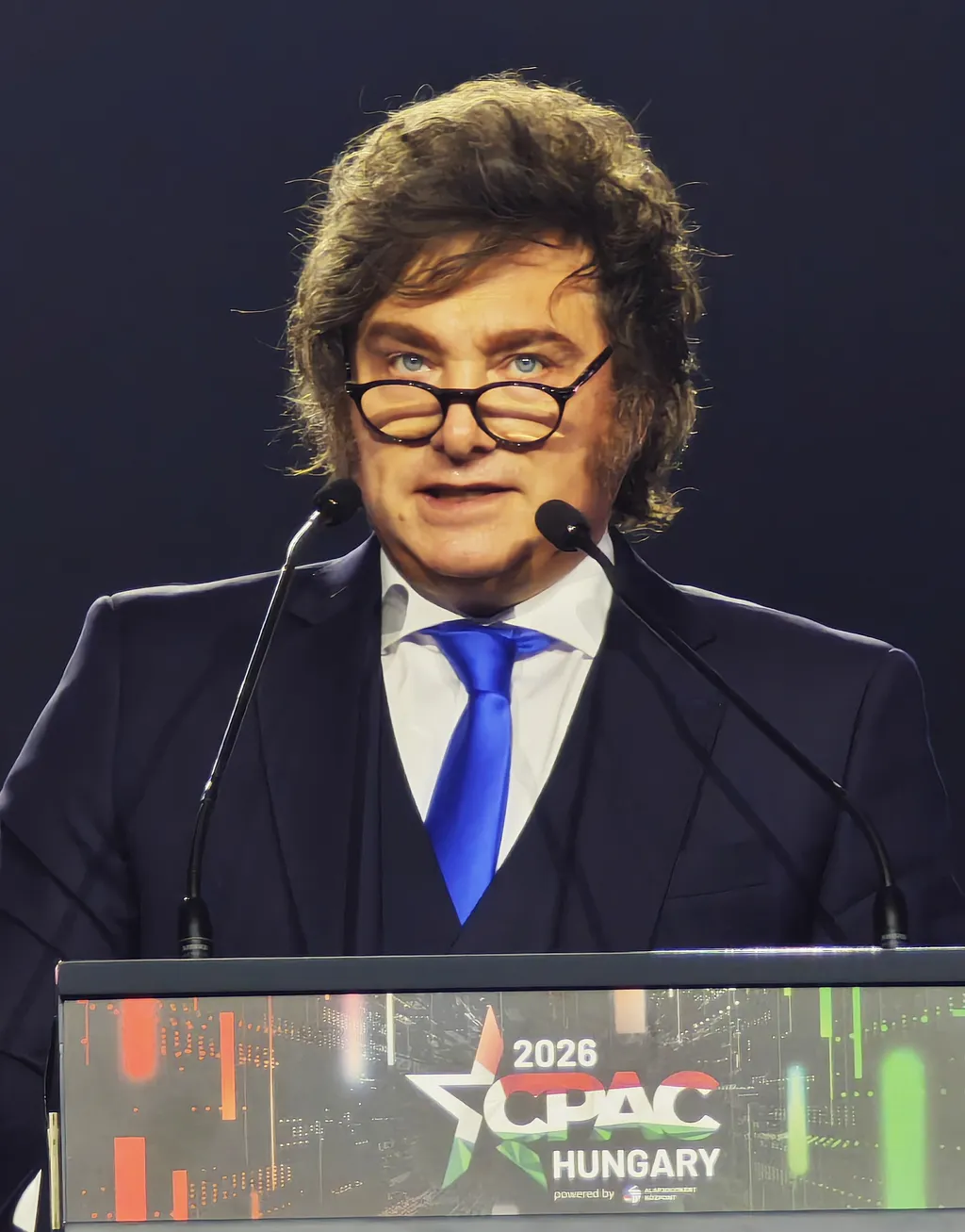Argentine President Javier Milei speaking at a podium at CPAC Hungary 2026.