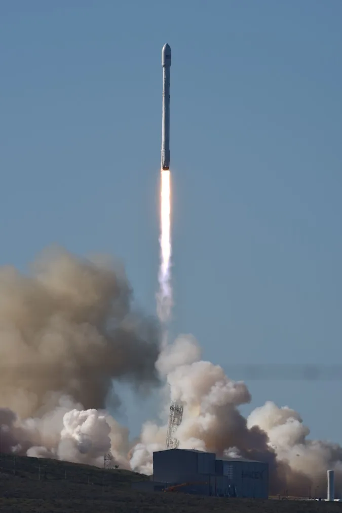 A SpaceX Falcon 9 rocket lifting off from Vandenberg Space Force Base, California