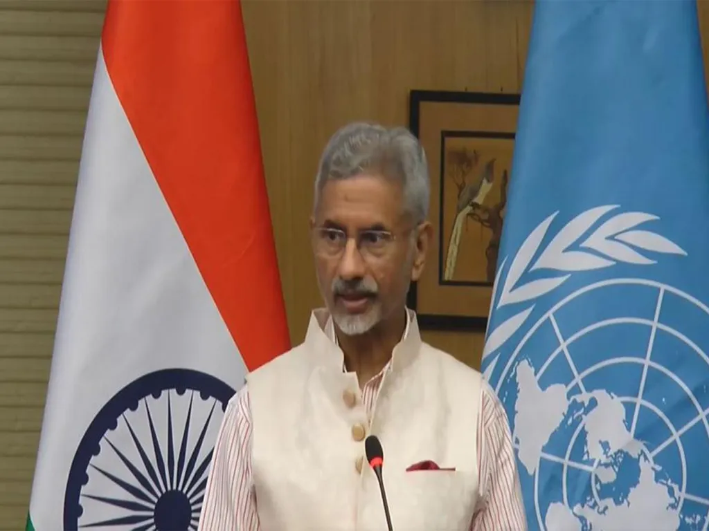 External Affairs Minister S. Jaishankar speaking at a briefing with Indian and United Nations flags behind him