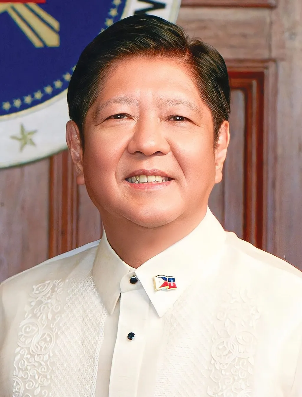 Official portrait of Philippine President Ferdinand 'Bongbong' Marcos Jr wearing a barong Tagalog with a Philippine flag pin.