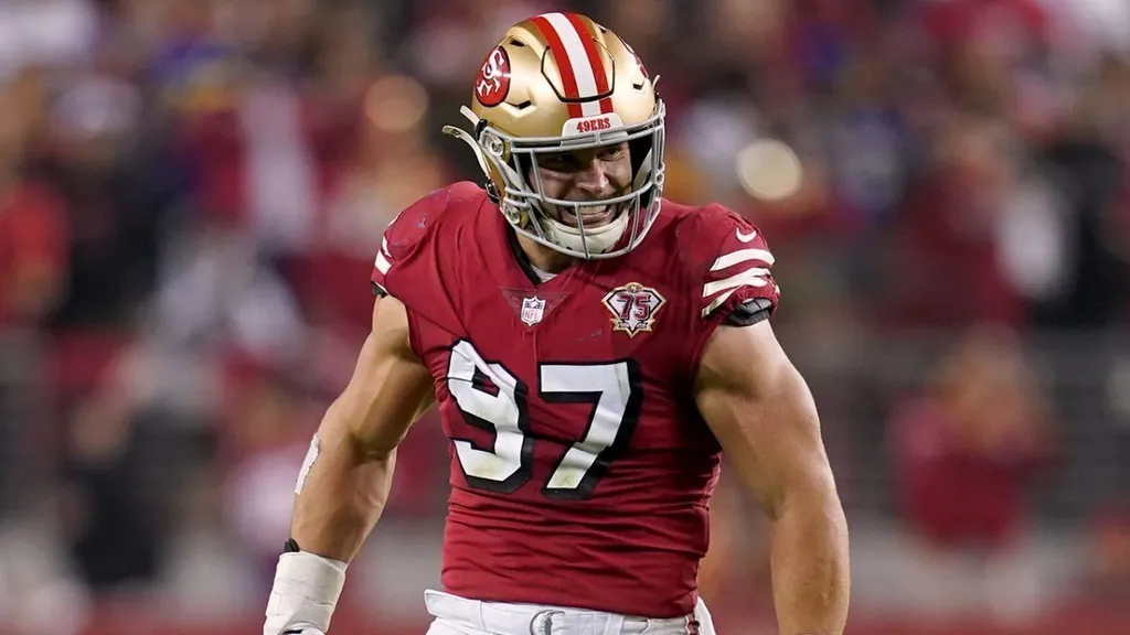 San Francisco 49ers defensive end Nick Bosa, wearing number 97, in a red home jersey on the field