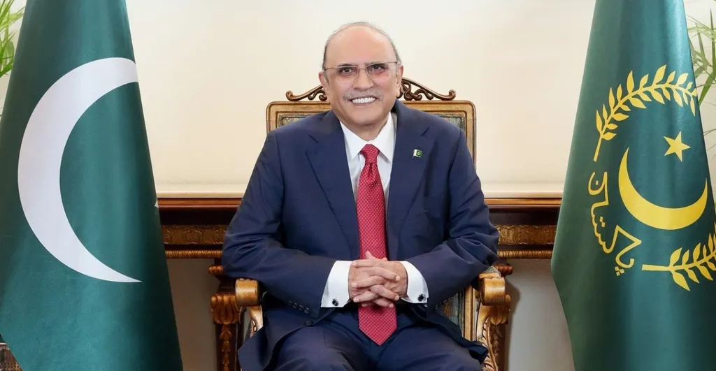 President Asif Ali Zardari seated between the Pakistani national flag and the presidential standard