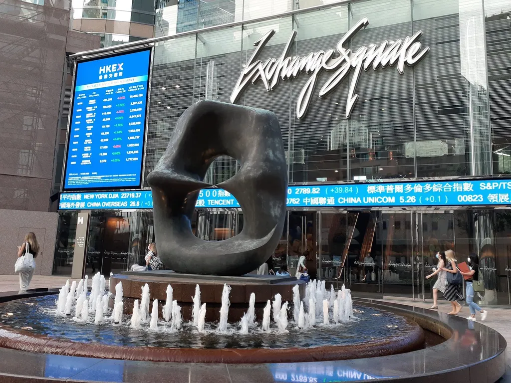 Exchange Square in Central, Hong Kong — home of the Hong Kong stock exchange — with HKEX stock-price ticker boards