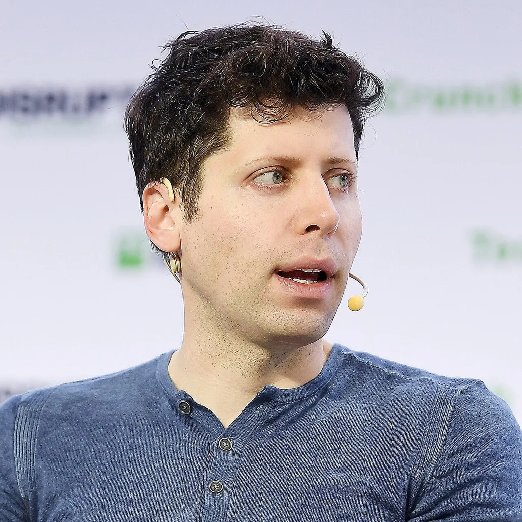 OpenAI CEO Sam Altman speaking at a conference with a microphone headset