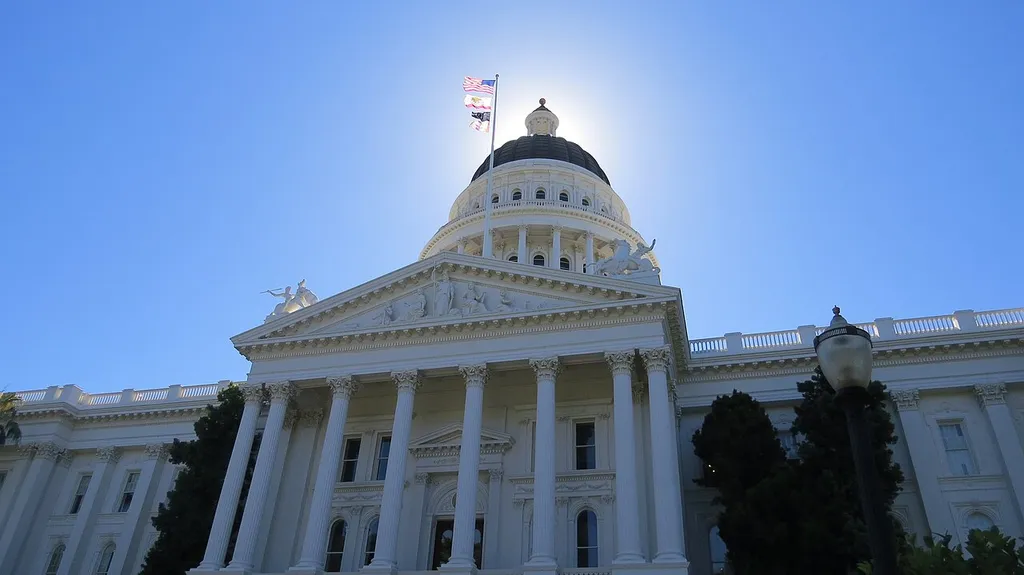 The California State Capitol building in Sacramento with its dome against a clear blue sky