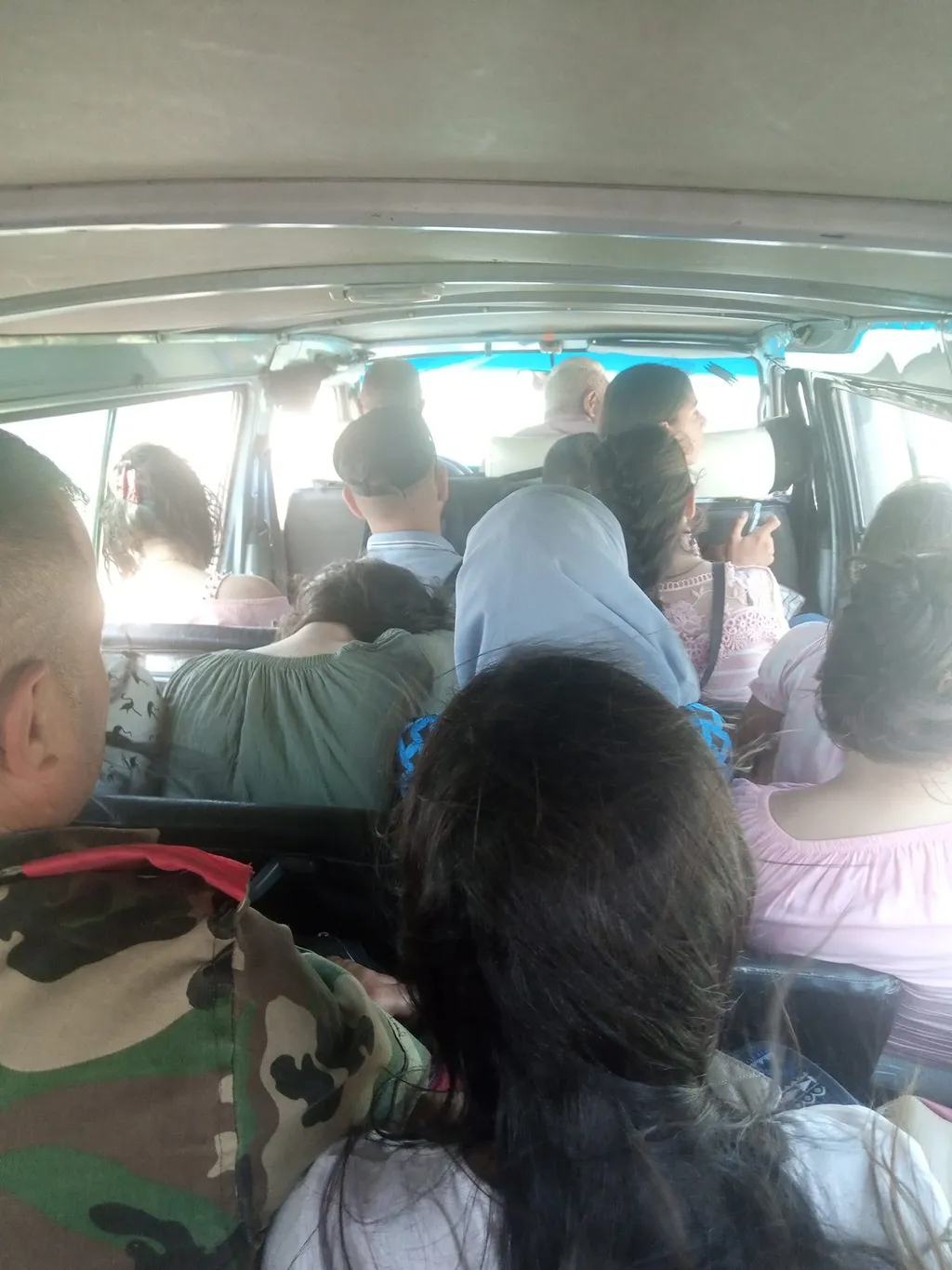 Passengers aboard a crowded microbus on a Homs rural route, Syria (file photo, July 2023)