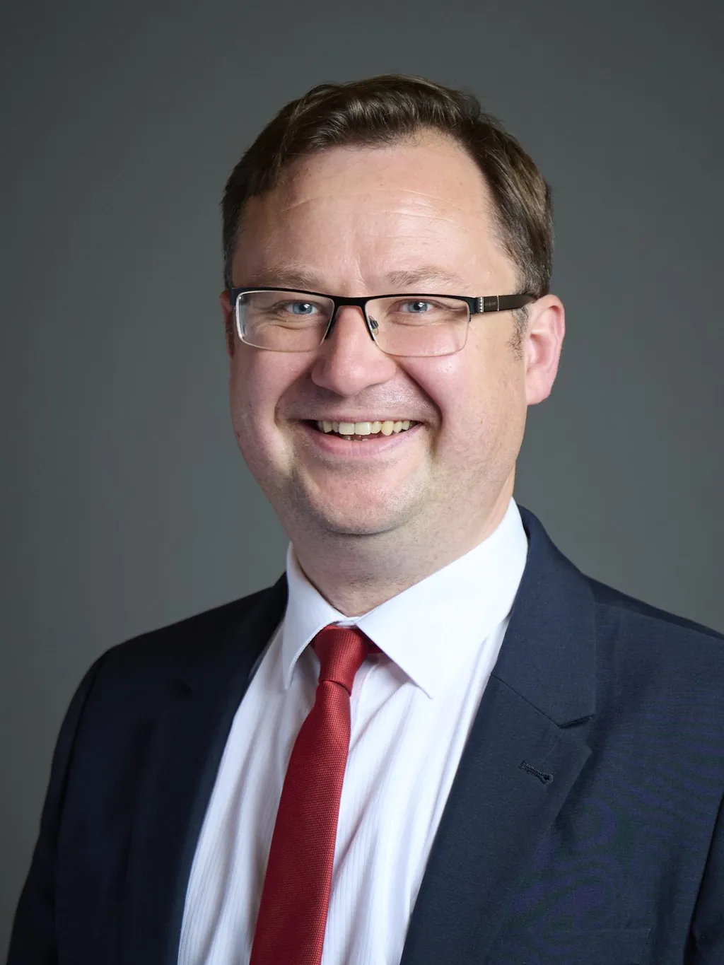 Official portrait of Justice Secretary Alex Norris