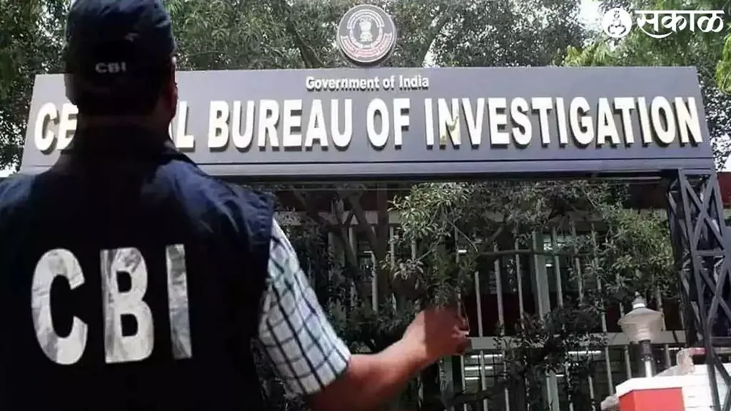 Central Bureau of Investigation headquarters sign with a CBI officer in the foreground