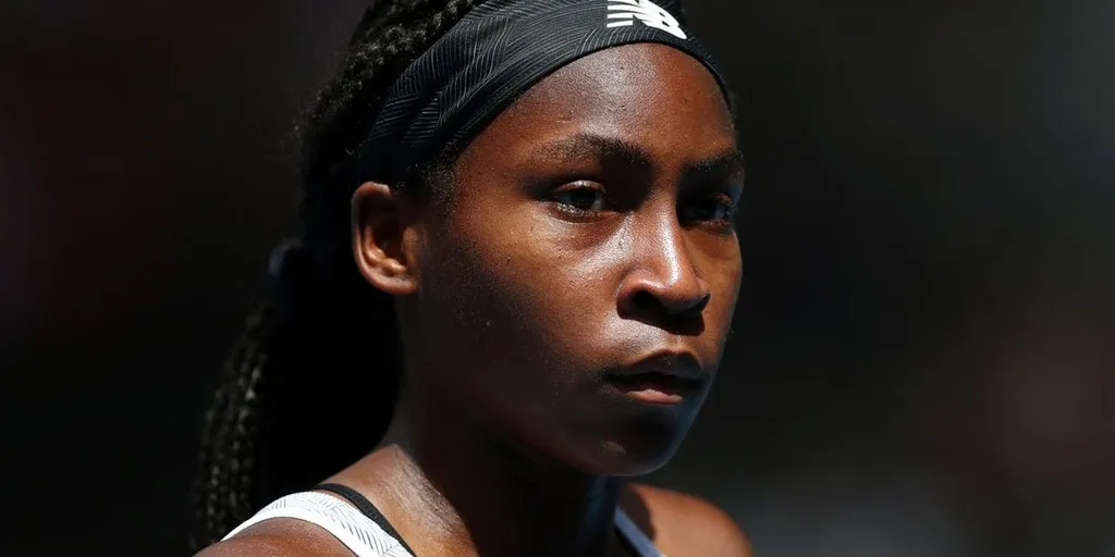 Coco Gauff wearing a New Balance headband, close-up on court