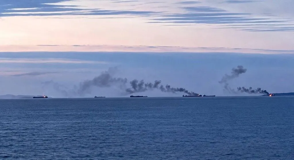 Cargo vessels burning at sea in the Black Sea with thick smoke rising