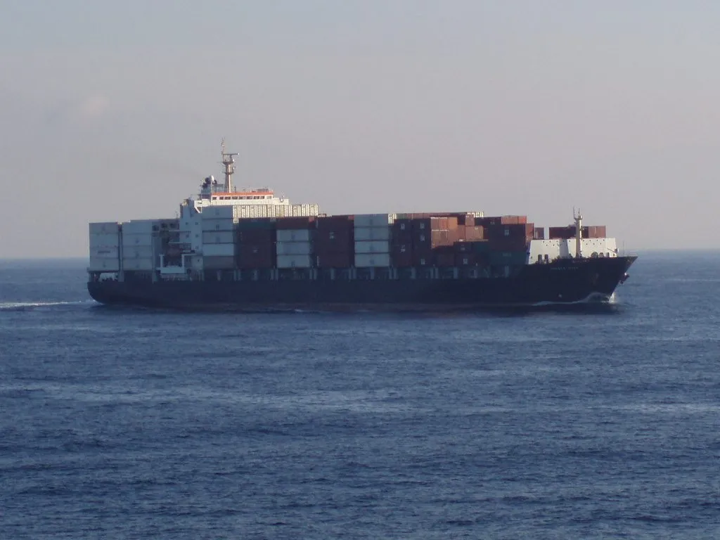 A container ship underway at sea.