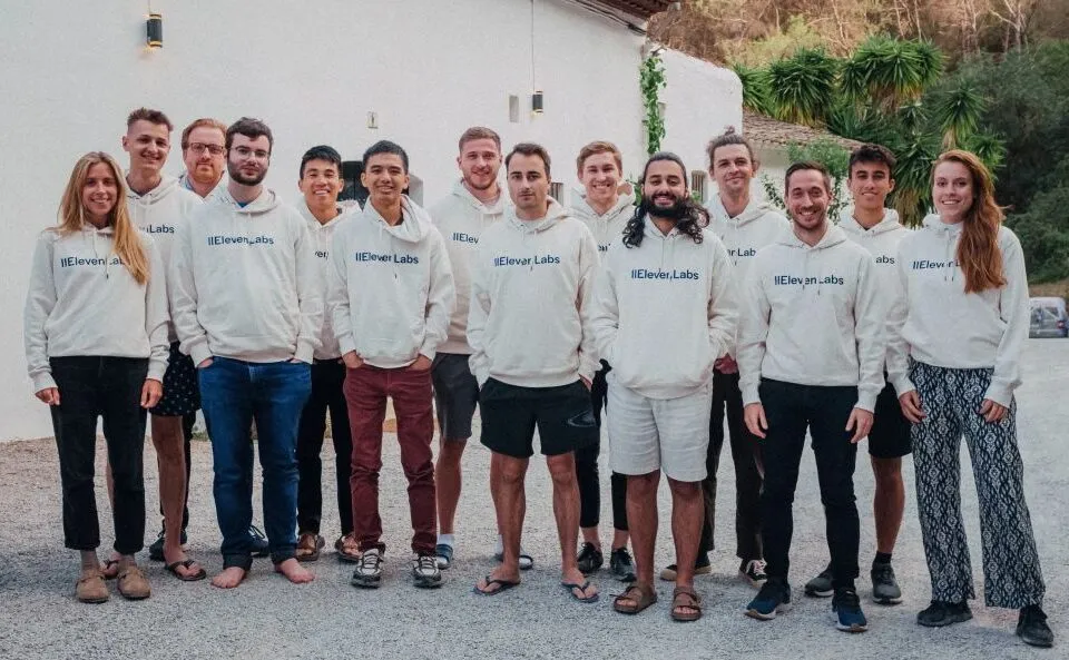 The ElevenLabs team posing together in branded hoodies