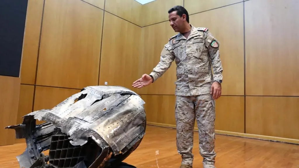 Saudi-led coalition spokesman displays debris of a destroyed Houthi ballistic missile at a Riyadh news conference