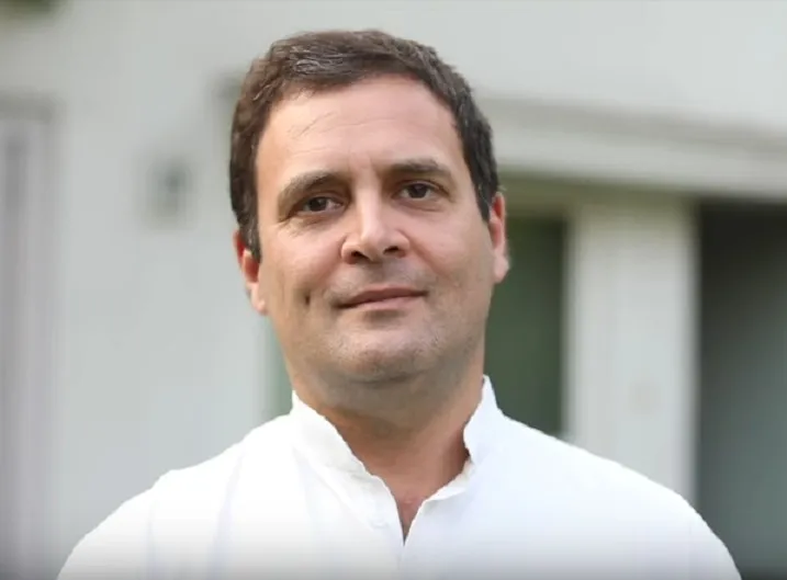 Rahul Gandhi in a white kurta, looking towards the camera.