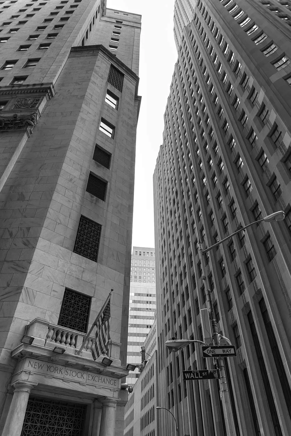 The New York Stock Exchange building on Wall Street, its name engraved above the entrance columns
