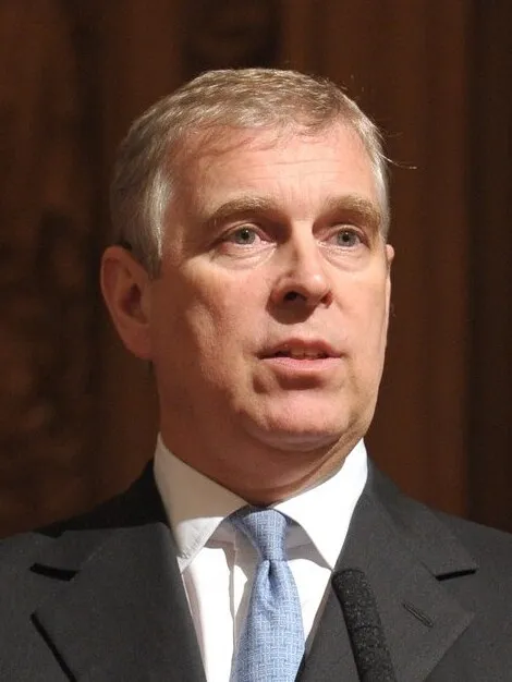 Andrew Mountbatten-Windsor, head-and-shoulders portrait in a suit and blue tie.