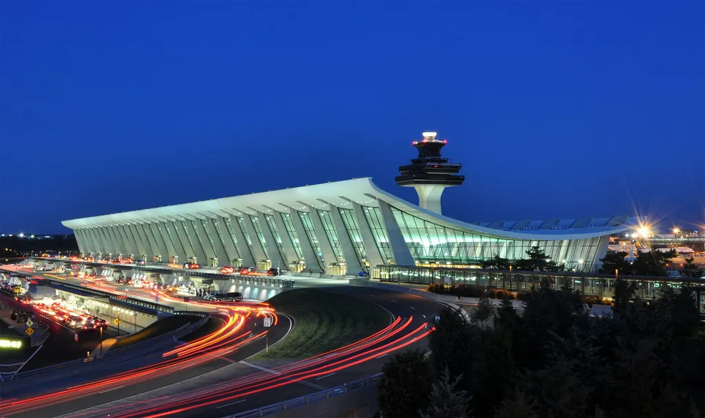 The main terminal of Washington Dulles International Airport at dusk, where Arfat Sheikh was detained by ICE