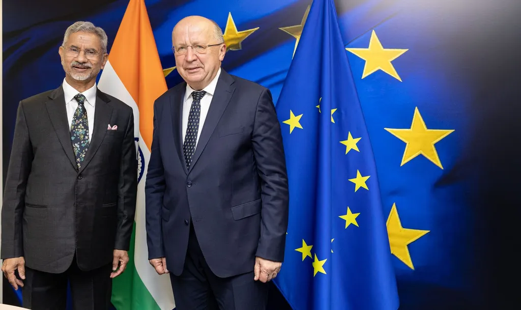 India External Affairs Minister S. Jaishankar (left) with European Commissioner Andrius Kubilius in front of Indian and EU flags, June 2025