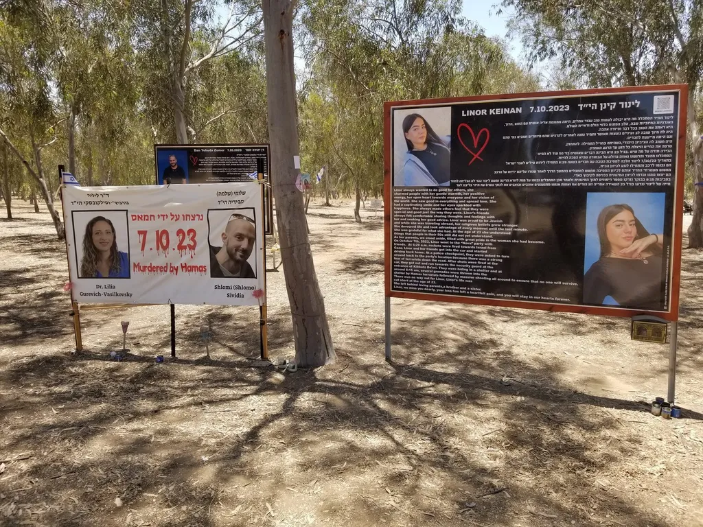 Rows of memorial banners bearing the faces of victims at the Nova Music Festival memorial site near Re’im, Israel.