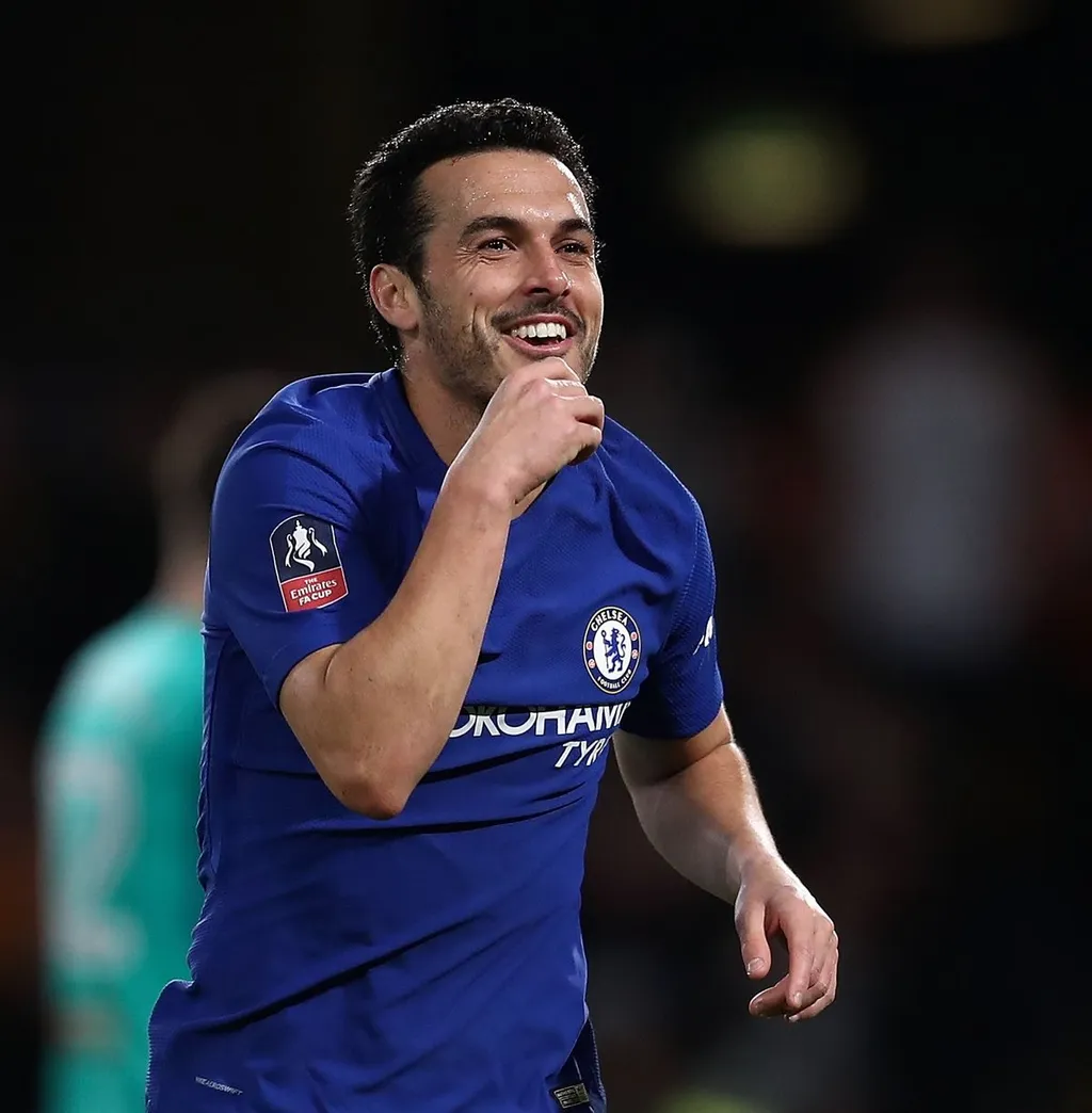 Pedro Rodriguez smiling and celebrating in a Chelsea shirt