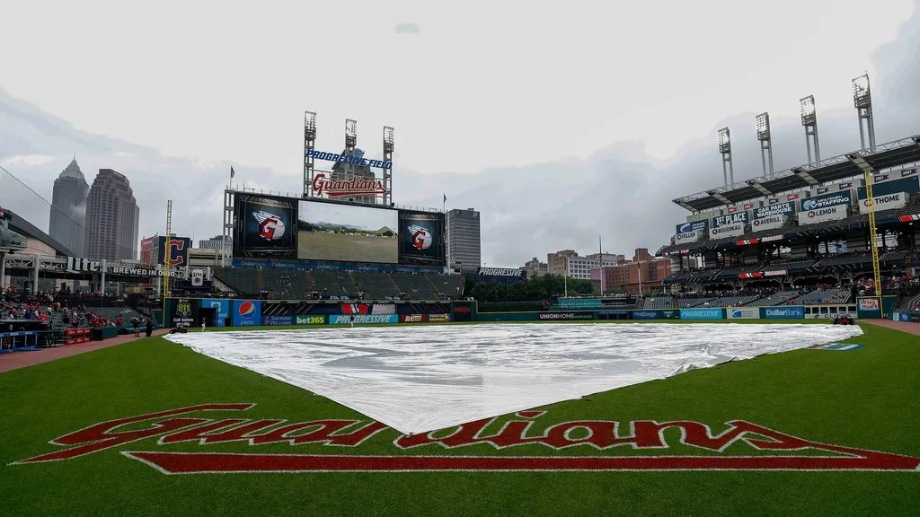Rain tarp covers the infield at Progressive Field in Cleveland during a rain delay