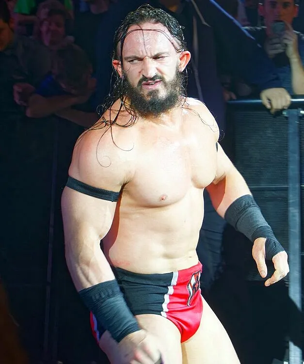 Benjamin Satterley, known as wrestler PAC, in the ring as Neville in 2017