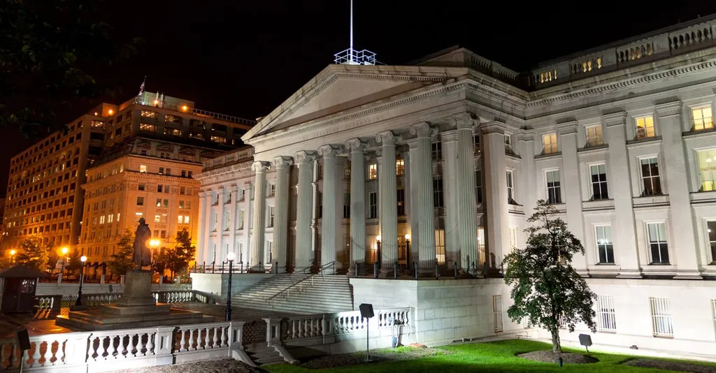 The U.S. Treasury Department building illuminated at night in Washington, D.C.