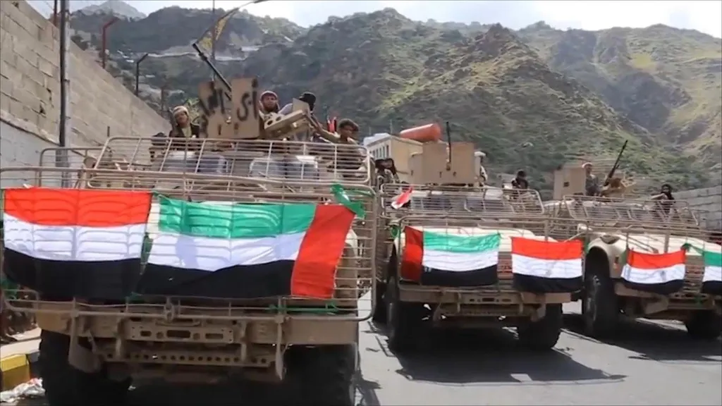 UAE-flagged armored military vehicles with armed personnel in a mountain town in Yemen