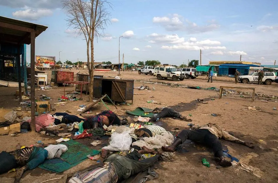 Victims lying in the dusty Abyei market area after the drone strike, with UN vehicles in the background