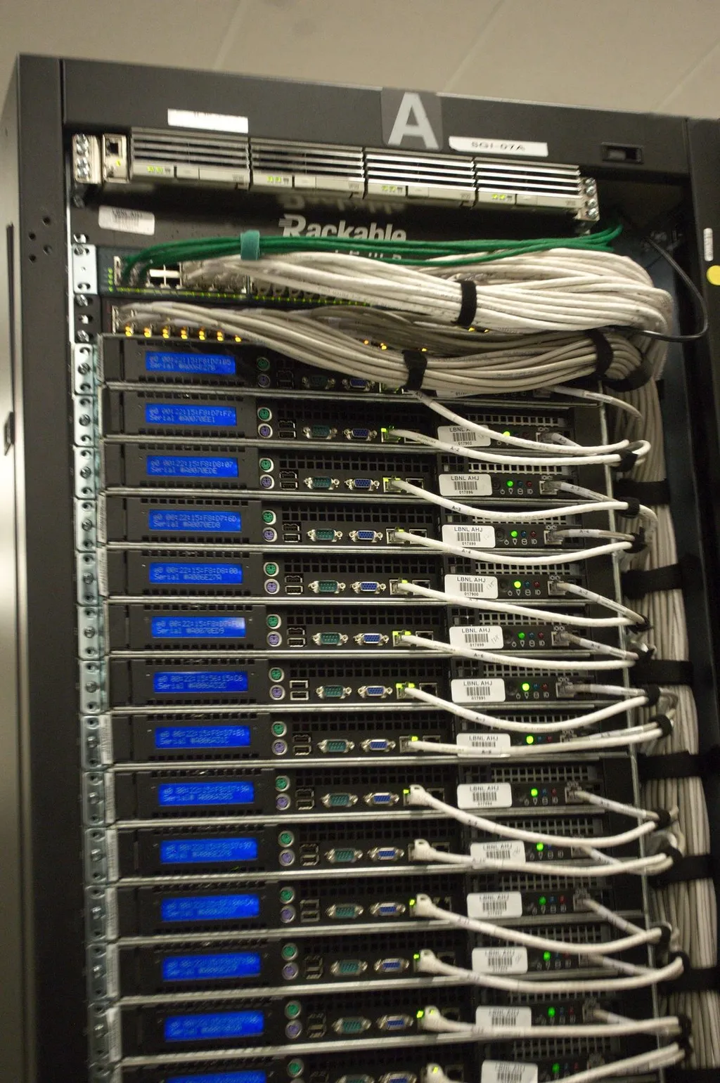 Illustration: rear view of a data-centre server rack, symbolising the web servers exposed by the PHP2Shell flaws.