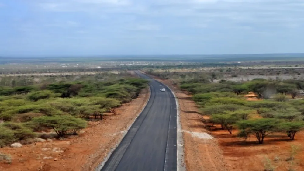 A paved road through arid scrubland leading toward the border town of Moyale, Ethiopia/Kenya