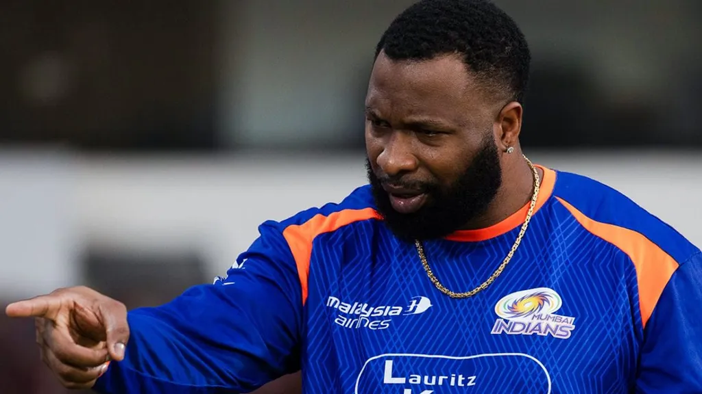 Kieron Pollard pointing during a Mumbai Indians training session in a blue MI jersey