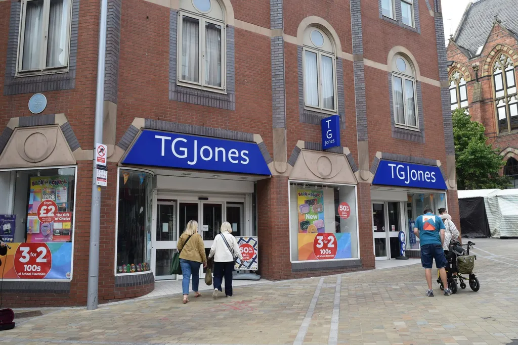 TG Jones high-street storefront in Leeds with blue TGJones signage and shoppers entering