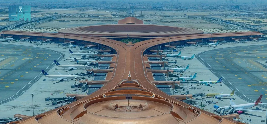 Aerial view of Riyadh airport terminal with aircraft parked at gates