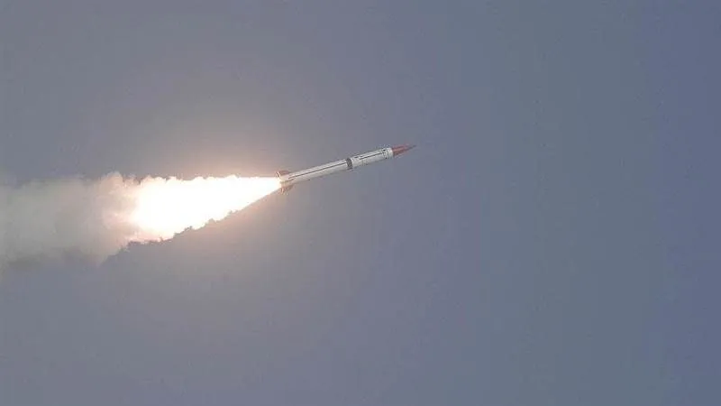 A missile streaks across the sky