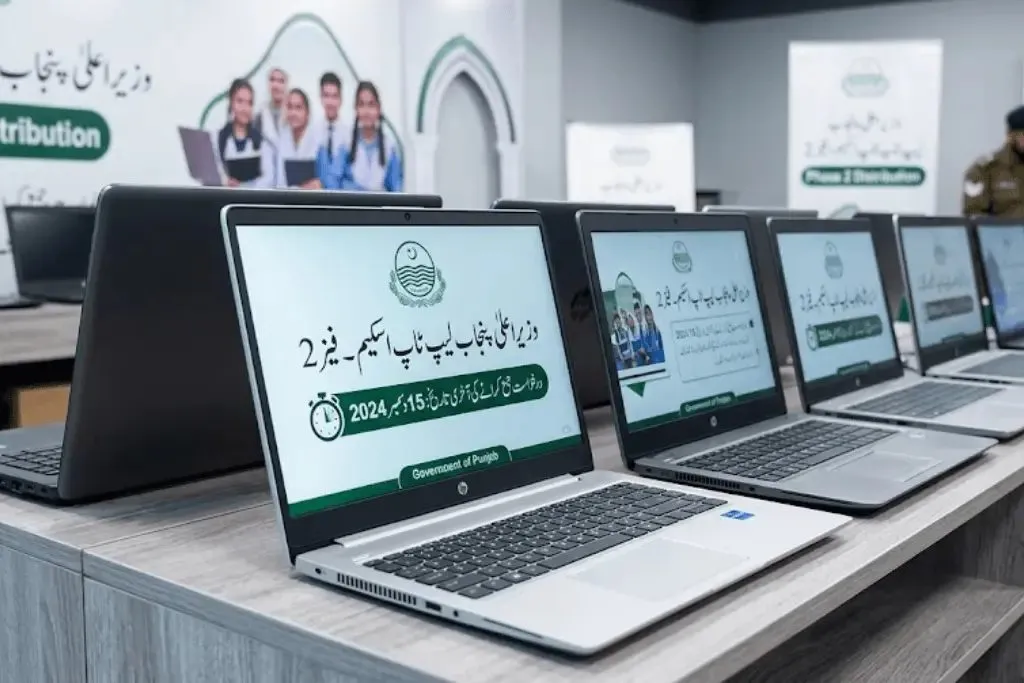 Laptops lined up on a table at a Punjab laptop distribution event