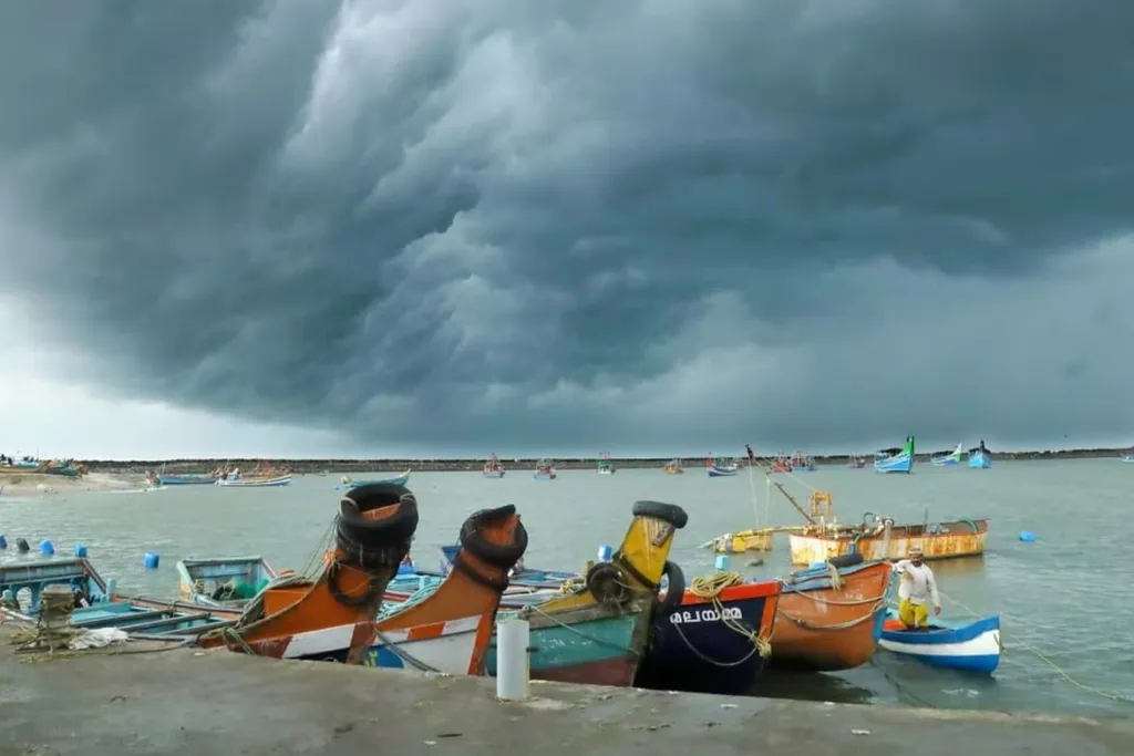 Dark storm clouds over fishing boats moored in a harbour