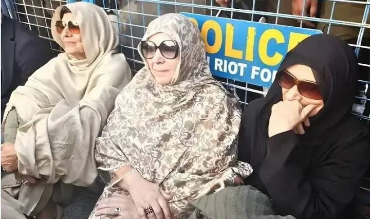 Imran Khan sisters seated during a detention protest near police