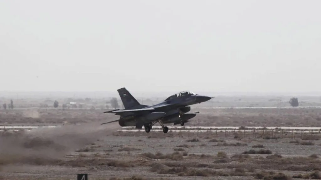 A Jordanian fighter jet taking off from a desert runway