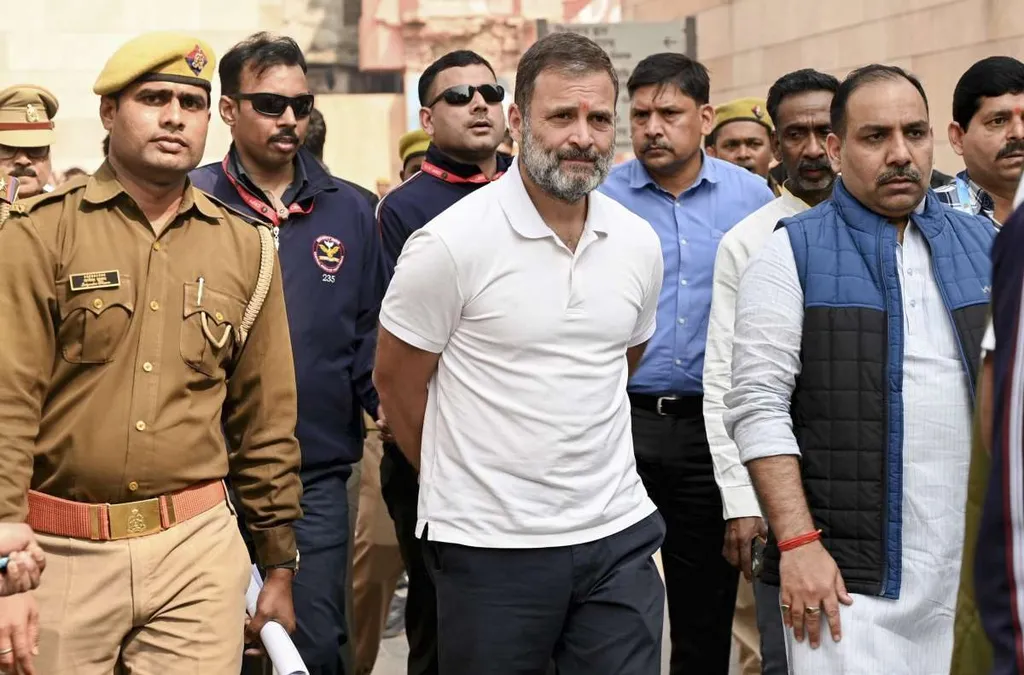 Rahul Gandhi walking with police and security personnel outside a court