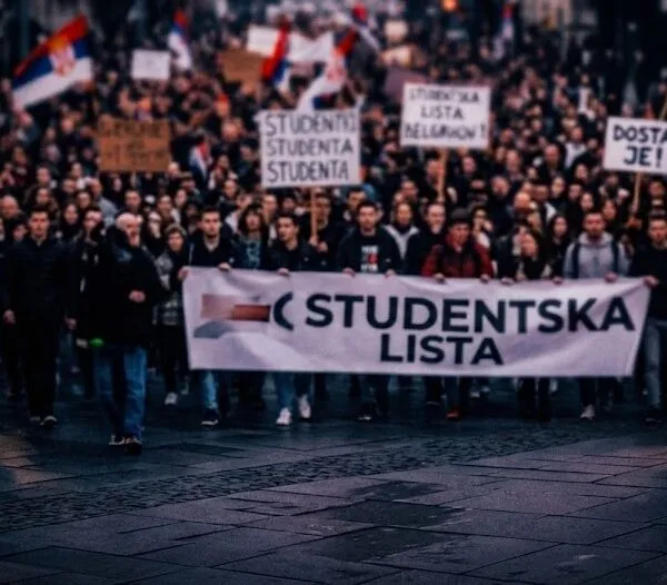 Supporters march carrying a Studentska Lista banner in Serbia