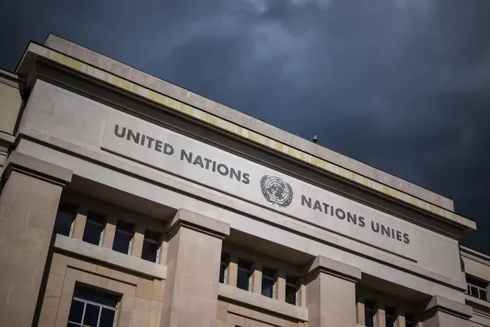 The United Nations building under a dark sky