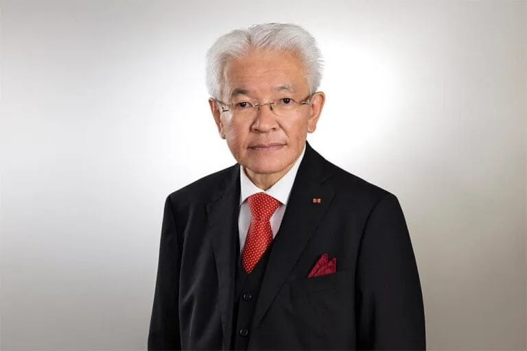 Former Japanese prime minister Yasuo Fukuda in a dark suit and red tie