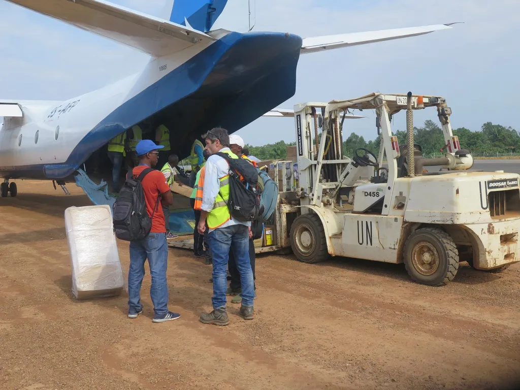 UN workers unloading boxes of medical supplies from a cargo plane at Beni airport, North Kivu, during an Ebola response in the Democratic Republic of Congo