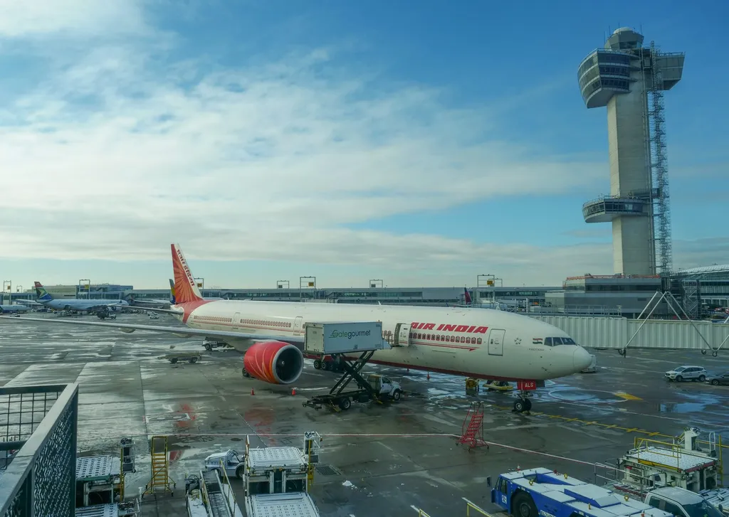 An Air India Boeing 777-300 (registration VT-ALS) taxiing at an airport