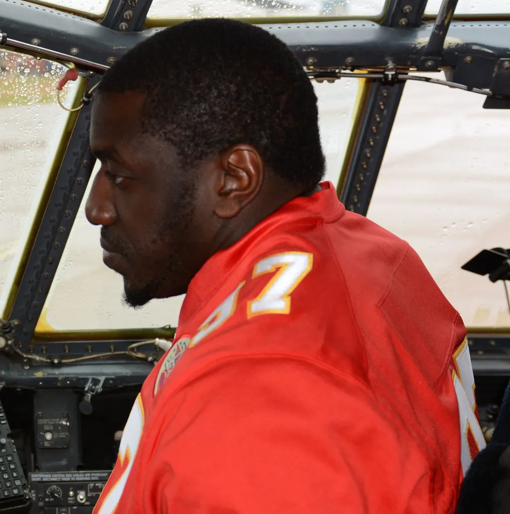 Allen Bailey wearing a Kansas City Chiefs number 97 jersey during a 2015 team visit