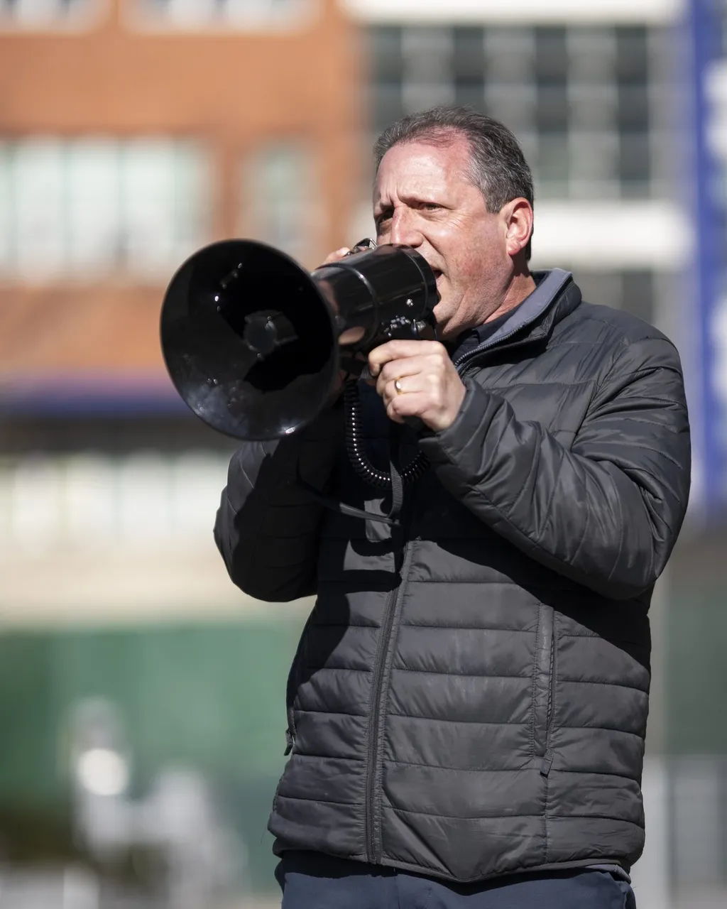 Portrait photograph of Brad Lander speaking at a rally in March 2026