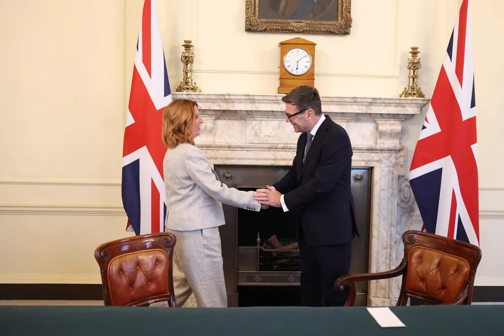 Prime Minister Andy Burnham shaking hands with Louise Haigh during a cabinet appointment at 10 Downing Street in July 2026.