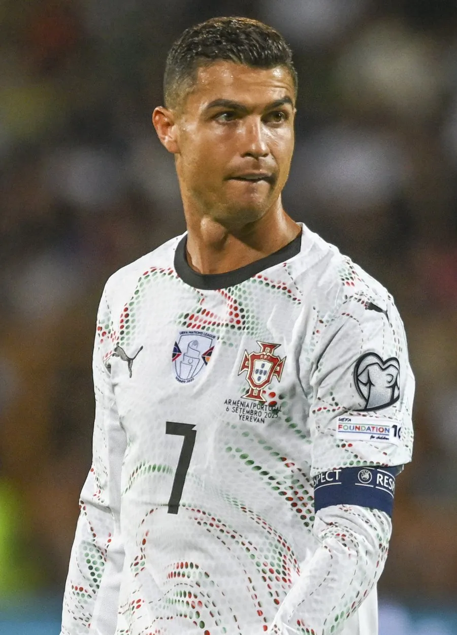 Cristiano Ronaldo in Portugal's white kit with the captain's armband